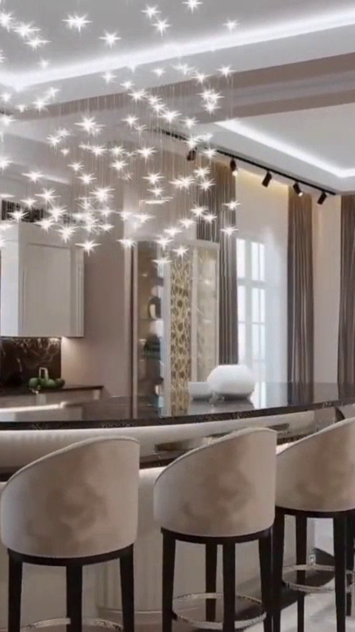 A vertical cut of the listing video for Reels and Stories Vertical frame from a listing video of a kitchen with a marble island, formatted for a phone screen